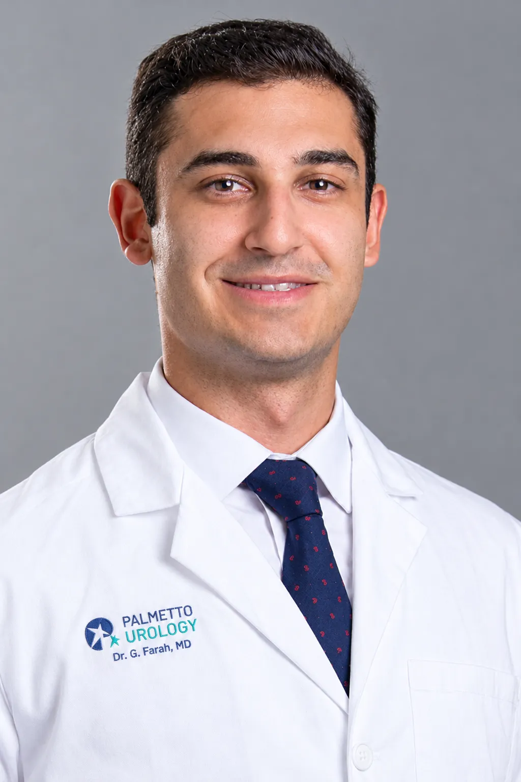 Dr. Guillaume Farah in a white coat